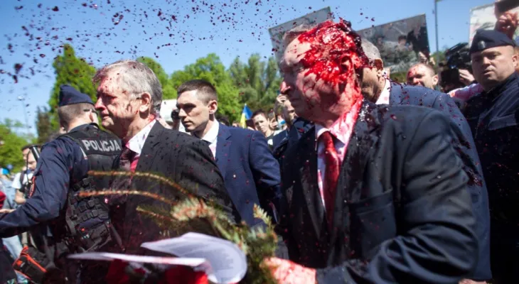 Protesters hit the Russian ambassador in Poland with red paint