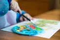Reasons for the delay in starting the implementation of the child care deal concluded between Ontario Province and the government