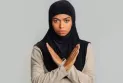 A man hits a Muslim teenage girl and insults her with racist phrases