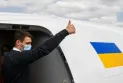 Senior officials and parliamentarians board a plane carrying Ukrainian refugees to welcome them in Canada