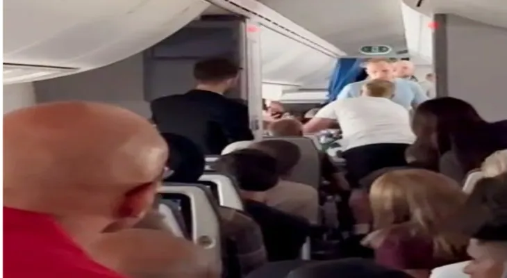 LOT Polish Airlines flight 41 to Toronto makes an emergency landing due to a Canadian passenger attempting to open the plane doors during the flight