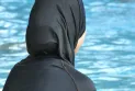 A Muslim family struggles to swim because of the burkini