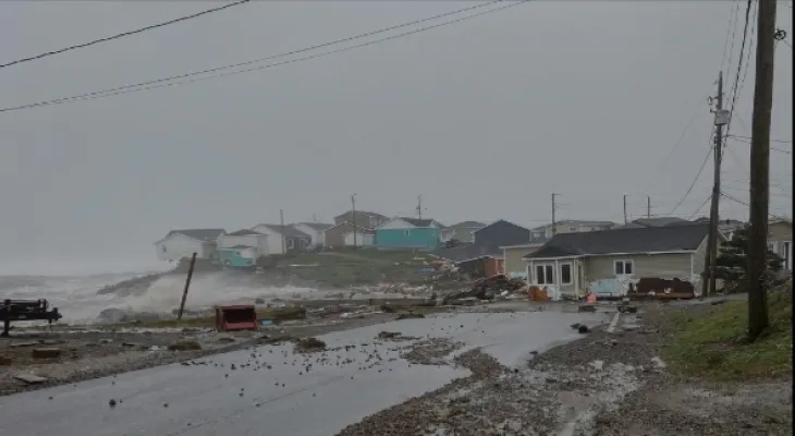 A search is underway for a woman after the sea swept through her house following Hurricane Fiona.