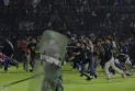 174 killed after a crowd crush of fans leaving a football match in Indonesia