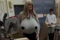 Ontario College of Teachers' Board of Directors agrees to review its professional standards after an incident of a teacher wearing breast prostheses in class