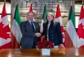 Signing a memorandum of understanding between Canada and Kuwait to develop relations between them