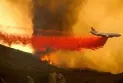 The death of a pilot following the crash of a helicopter fighting wildfires in northwestern Alberta.