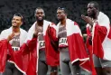 The Canadian men's relay team wins silver medals at the reallocation ceremony.