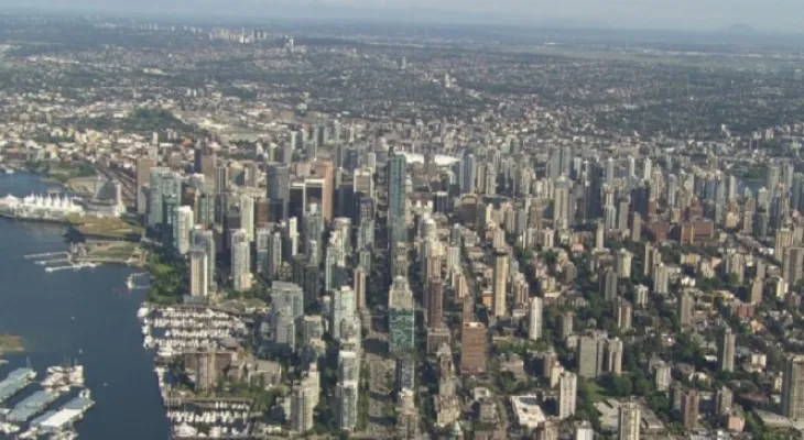 The increase in home prices in Vancouver with a significant annual increase in sales.