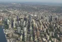The increase in home prices in Vancouver with a significant annual increase in sales.