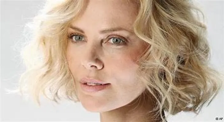 Charlize Theron denies undergoing a failed cosmetic procedure and says, "I’m just getting older."