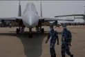 The police are investigating reports that former members of the Canadian Air Force are training pilots in China.