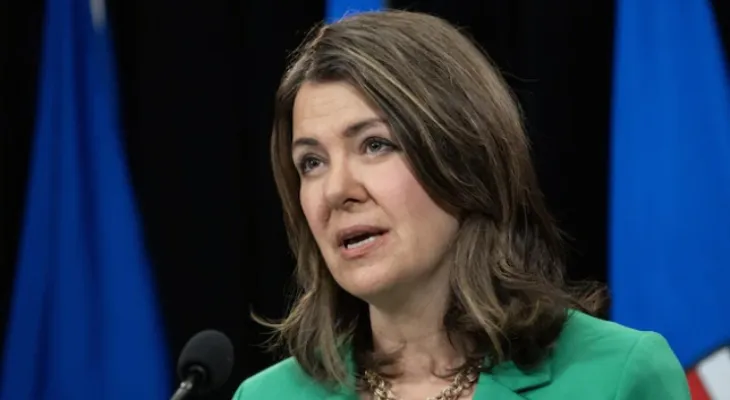 Alberta's Premier orders a review of shared kitchens in Calgary where hundreds of children were infected with E. coli.