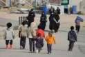 Canadian accused of committing a terrorism-related crime upon returning from a detention camp in Syria.