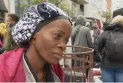 Transferring about 60 asylum seekers exposed to harsh weather conditions to a shelter at a church in Toronto.