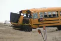 Injury of 5 children and one adult and their transport to the hospital after a school bus crash north of Calgary