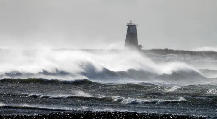 Warnings of winds across all marine areas and power outages affecting 70,000 people