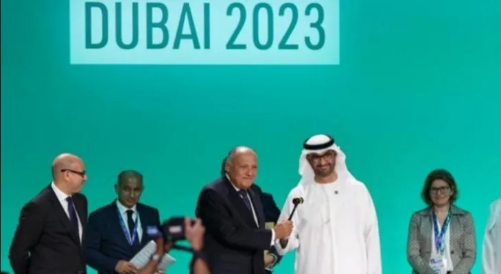 The climate conference adopts a historic agreement calling for a transition towards abandoning fossil fuels...