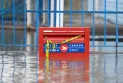 Canada Post sells part of its business to reduce expenses, and experts say that this is still not enough.