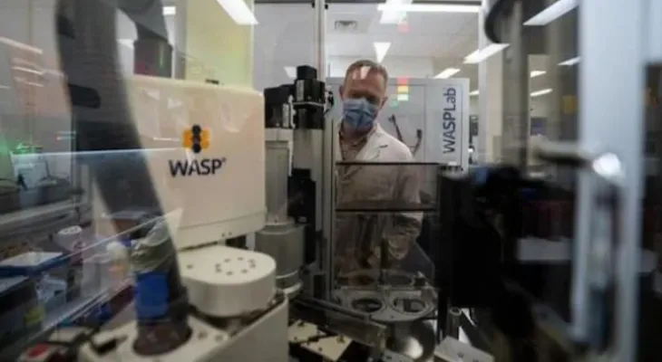 AI-guided robots performing laboratory tasks in a Vancouver hospital