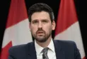 Details of the warning issued by the federal government to the former Minister of Immigration