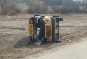 Injury of several children and a driver in a school bus overturn near Woodstock, Ontario