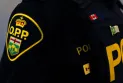 Placing a special pin on French-speaking Ontario police officers