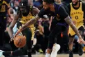 Russell leads Lakers to a 128-111 win over Raptors