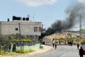 Hundreds of Israeli settlers attack Palestinian villages in the occupied West Bank after the discovery of the body of the missing boy.