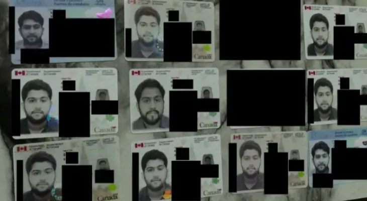 Toronto police arrest 12 people on charges of planning credit card fraud.