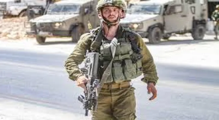 Hebrew newspaper: An Israeli soldier throws a sound bomb at the Ministry of Defense office