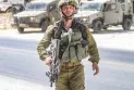 Hebrew newspaper: An Israeli soldier throws a sound bomb at the Ministry of Defense office