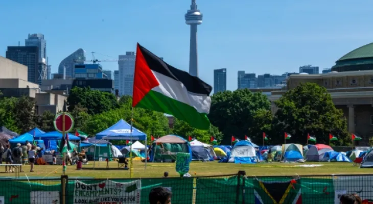 The graduation celebrations at the University of Toronto begin as pro-Palestinian protests continue in the background.
