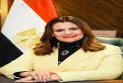 The Egyptian Minister of Immigration congratulates a Canadian Egyptian for winning the "Pharmacist of Canada" award.