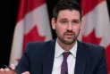 The Canadian Minister of Housing announces the launch of a $1.5 billion cooperative housing development program.