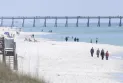 Florida warns of shark dangers along Gulf Coast beaches after 3 people were attacked.