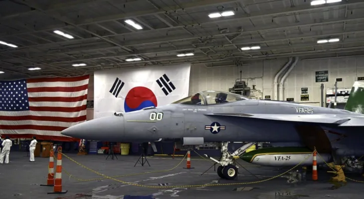 An American aircraft carrier arrives in South Korea in a show of strength against North Korea's nuclear armament.