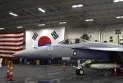 An American aircraft carrier arrives in South Korea in a show of strength against North Korea's nuclear armament.