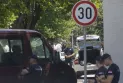 A young man was shot dead after a police officer guarding the Israeli embassy in Serbia was injured.