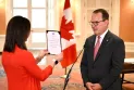 Liberal House of Commons leader Steven MacKinnon takes the oath of office as Minister of Labour to replace O'Regan.