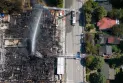 Officials: Removing the collapsed crane at the Vancouver fire site may take two weeks.