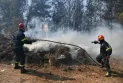 Hundreds of firefighters are battling a massive out-of-control forest fire on the outskirts of the Greek capital.