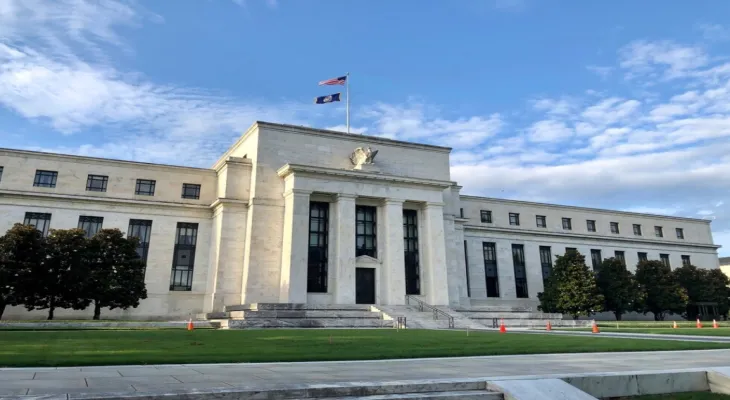 The U.S. Federal Reserve cuts interest rates by 0.25% amid ongoing inflation and labor market challenges.