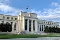 The U.S. Federal Reserve cuts interest rates by 0.25% amid ongoing inflation and labor market challenges.