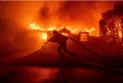 Massive fires sweep through Los Angeles, forcing thousands to evacuate.