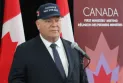 A simple hat bearing the phrase "Canada is not for sale" becomes a national symbol and achieves record sales.