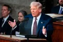 Trump signs a decision to postpone the imposition of tariffs on imports from Canada and Mexico for one month.