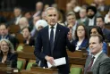 The Canadian Parliament resumes its work amid a promise from the new Prime Minister to expedite the passage of a tax cut.