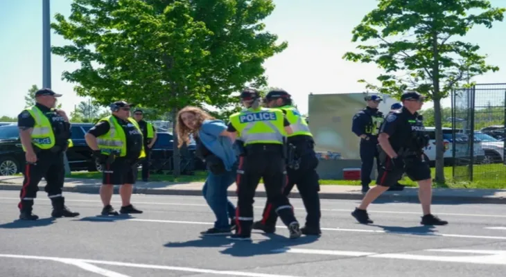 Arrest of a volunteer journalist during arms fair protests in Ottawa sparks debate over press freedom